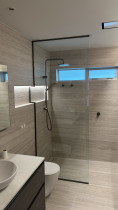 Shower screen glazed around a shelf