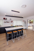 Extension & Renovation in Blockhouse Bay by Auckland Building Specialists Ltd - New Kitchen, Floor and door to deck area