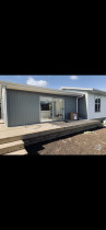 Craig Morris and Marcia Morris - Relocatable House Mangawhai inloved foundations and re gibing in side and a deck