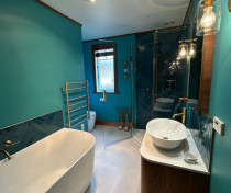 A Stunning Transformation - This modern renovation by Cleanline Bathrooms introduces a curved back-to-wall bath and classic subway tiles - the perfect blend of style and function.