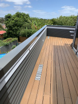 Outdure floating deck and aluminium cap flashing - Here we renewed the existing membrane and installed this attractive Outdure floating deck system then we raise the balustrade wall height and installed a powder coated aluminium cap flashing