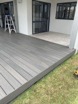 Outdure deck - We installed Outdure's resort decking and mineral tile combo over Quickbuild framing to create this beautiful and functional outdoor area!