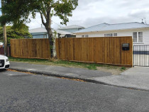 Fencing, concrete, pebbles, fence stain and topsoil and seeded