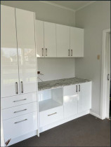 Med with Wall Cabinets - One side of a medium kitchen with laminate benchtop installed.