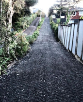 Driveway improvements - Overland flow path running through driveway. Driveway raised and compacted preventing flooding and scouring