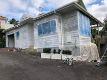 Painting a house in Meadowbank, Auckland