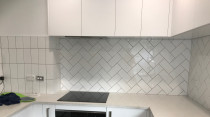 Herringbone 200 x 100 combination completed by Just Splashbacks - Female Tiler