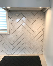 75 x 250 herringbone by Just Splashbacks - Female Tiler