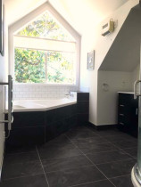 Bathroom: floor and wall tiled