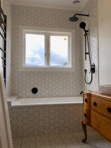 Bathroom tiled (vanity, bathtub splash-back, floor)