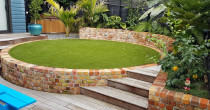 Brickwork, deck and planting by Lakeside Landscapes