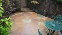 Courtyard patio by Lakeside Landscapes - Transformed this small courtyard from overgrown bushes and pebble area, to a usable seating area. Indian sandstone pavers and some low maintenance planting.