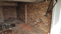 Reclaimed Brick Garage wall by Lakeside Landscapes