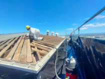 Staged Removal and cleaning - Removal of asbestos roofing sheets is undertaken in a staged manner so that all disturbed and exposed areas are cleaned with H-class vacuums immediately and covered with waterproof tarps.