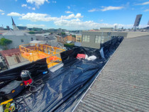 Wrapping and bagging load out point - Platform scaffolding with designated roof sheet wrapping area before loading down scissor lift to skip bin. All areas of the scaffold are secured with polythene for protection from dust and debris. Cleaned daily.