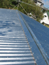 Garage roof (2) - New heavy gauge corrugated Zincalume roof cladding laid to the shed roof.