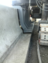 Slip formwork machinery - Layout concrete barriers on the motorway using slip formwork machinery from AUS. Finishing and joints cutting every 3m on the barriers