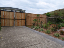 Vertically Clad Fence and Gate with Garden