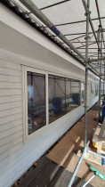 Painting the weatherboard and soffits (before)