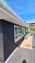 Painting the weatherboard and soffits (after)