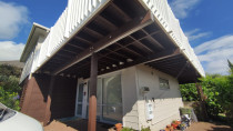 Painting the weatherboard and oiling the deck