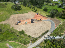 Earthworks project - A good client needed us to get their section ready new dwellings. This involved stripping of the topsoil, benching and compacting the earth to create flat space for a new 3 bedroom home and a large shed. The access track and metal prep was also placed by us. Job well done and on budget.