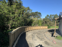 New retaining wall - A lovely client was subdividing the rear of her property and required a new retaining wall for vehicle access. We constructed this curved retaining wall, handrail and wheel stops. The engineers were thrilled with our processes and the results speak for themselves.