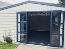 Garage Renovation - Top 2 Bottom Carpentry Ltd removed the Garage door and replaced it with a pair of french doors, Insulated and gibbed the walls, then plastered ready for painting.