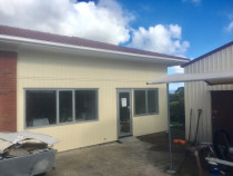 Roof upgrade and Reclad (Part 2) - This image shows the new roof and cladding complete, with all new windows and doors.
Such a transformation by Top 2 Bottom Carpentry Ltd!