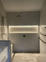 Bathroom custom lighting and ladder towel rail by TopMark Electrical - Recently completed bathroom fit off with custom LED lighting feature in the shower and modern ladder style towel rails.