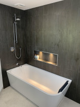 Campells Bay bathroom renovation - Cain Built Ltd. - Modern bath/shower combination - vertical brick pattern tiles on walls