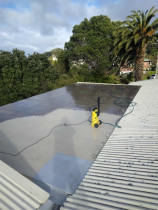 3. Roof Top Before - Right from the start - Waterblasting first to remove grime and ensure a clean surface before applying fibreglass aand Traffigard
Location: Lower Hutt