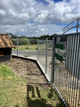 New fencing - Kaiwaka Playcentre we replaced the old timber fencing for a new 200 series block retaining wall and light steel fencing.