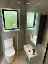 Full Bathroom installation on Rakino Island - Full bathroom installation on Rakino, including glass partition and cabinetry. Primo Plumbing always going above and beyond the plumbing work.