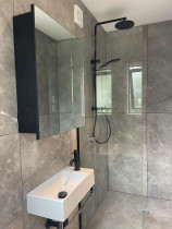 Full bathroom installation on Rakino Island - Full bathroom installation on Rakino, including glass partition and cabinetry. Primo Plumbing always going above and beyond the plumbing work.