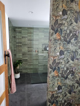 Bathroom - Batbroom done with 600×600 floor tiles and green subway tiles