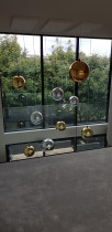 Paritai Drive Residence - Designer cluster pendants looking from top floor, above dining area.