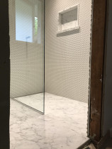 Carrara Marble Floor with Penny Mosaic Walls by Tile Technix Ltd - Tilers North Shore Auckland