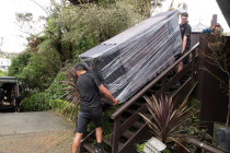 Cameron Ryan Transport | I've got this! - This piece is as long as the stairs it's coming down, the guys have it blanketed and wrapped for protection. Notice Murray in the background running up the hill to help - Tight team!