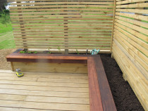 Planter box and seating area by DECKHQ