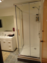 Acrylic, corner entry shower - This shower unit is ideal for tight spaces, as the square, corner entry sliding doors make access easy