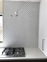 Scollaped mosaics by Just Splashbacks - Female Tiler