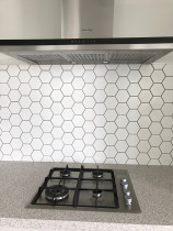 Hexagonal mosaics vy Just Splashbacks - Female Tiler