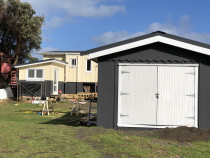 Newly painted exterior work - Recently painted exterior of cabins in Piha, Auckland by Paint Crew.