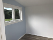 Interior paint work - Recently painted interior of cabins in Piha, Auckland by Paint Crew.