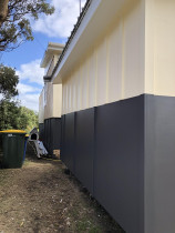 New exterior paint work - Recently painted exterior of cabins in Piha, Auckland by Paint Crew.