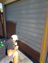 Repainting old garage doors to modernise exterior