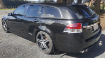 V8 Holden With 3 Stage Polish and Ceramic Coating by The Mobile Car Specialists Ltd - Over time, the stunning paint flecks within the paint on these black Holden's tend to disappear from sight. They come out again after our polish services, and the owners often comment that they didn't know those flecks were there in the first place! This Holden has had a new lease on life and looks like new again.